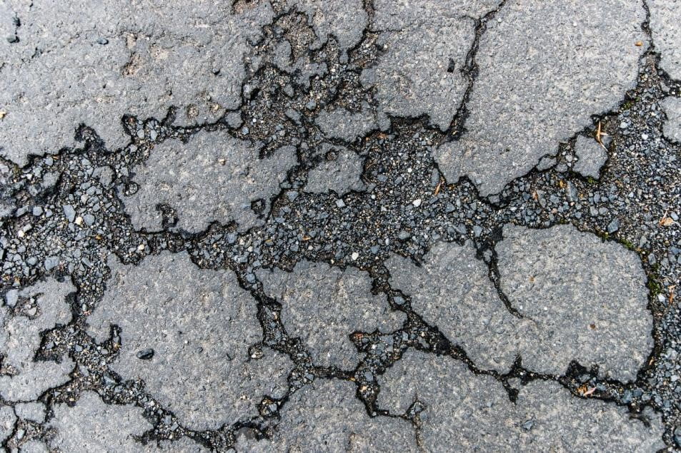 30358193-asphalt-road-crack-texture
